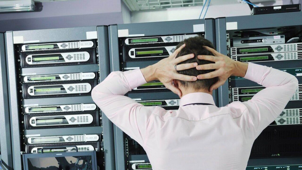 Data Recovery Services- Upset Man Looking at Servers